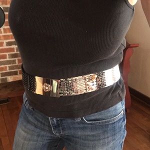 Silver metal belt with flower buckle.